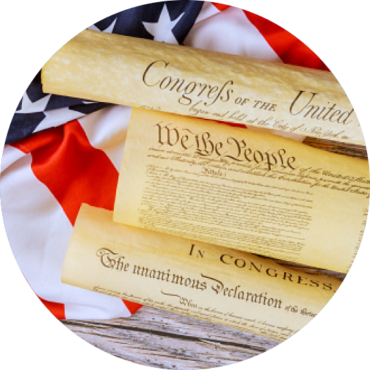 Scroll of Declaration of Independence laying on american flag